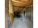 View of the interior of a house with exposed beams, studs, and plywood floors at 4384 Frances Ave, Sanford, FL 32773