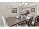 A well-lit dining room features neutral tones and a decorative chandelier at 4515 Sea Biscut Ct, Orlando, FL 32818