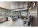 Relaxing sunroom featuring tile floors, comfortable seating, and a modern entertainment center at 4515 Sea Biscut Ct, Orlando, FL 32818