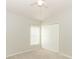 Comfortable carpeted bedroom featuring a ceiling fan, closet, and lots of natural light at 500 Pickfair Ter, Lake Mary, FL 32746