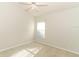 Bright carpeted bedroom featuring a ceiling fan, window, and neutral color palette at 500 Pickfair Ter, Lake Mary, FL 32746