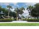 Community playground and picnic area with mature palm trees offering ample shade at 500 Pickfair Ter, Lake Mary, FL 32746