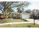 Charming home featuring a well-manicured lawn, a two car garage, and a traditional front entryway at 500 Pickfair Ter, Lake Mary, FL 32746