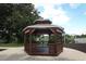 Charming community gazebo overlooking the lake, with benches, offering a relaxing outdoor space at 500 Pickfair Ter, Lake Mary, FL 32746