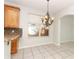 Bright kitchen area with granite countertops and wooden cabinetry at 500 Pickfair Ter, Lake Mary, FL 32746