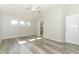 Spacious bedroom with high ceilings, luxury vinyl floors, and an ensuite bathroom at 500 Pickfair Ter, Lake Mary, FL 32746