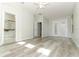 Bright main bedroom with an en suite bathroom, french doors, and luxury vinyl floors at 500 Pickfair Ter, Lake Mary, FL 32746