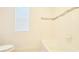 Bright bathroom with a tub, shower, and a window at 5030 Tibet Ct, St Cloud, FL 34772