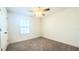 Cozy bedroom with a ceiling fan and a window allowing natural light at 5030 Tibet Ct, St Cloud, FL 34772