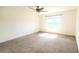 This airy room features a ceiling fan and a window providing natural light at 5030 Tibet Ct, St Cloud, FL 34772