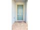 A charming blue front door, complete with a secure lock and a welcoming mat for guests at 5030 Tibet Ct, St Cloud, FL 34772