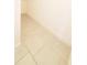 This hallway features light beige floor tiles and white baseboards at 5030 Tibet Ct, St Cloud, FL 34772