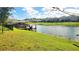 Scenic view of a serene lake with a wooden dock, offering a perfect spot for relaxation at 5030 Tibet Ct, St Cloud, FL 34772