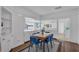 Bright dining room with seating for six and hardwood floors at 513 Wisconsin Ave, St Cloud, FL 34769