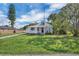 Charming home featuring a cozy front porch, lush lawn, and inviting curb appeal at 513 Wisconsin Ave, St Cloud, FL 34769