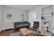 A beautifully staged living room with lots of natural light at 513 Wisconsin Ave, St Cloud, FL 34769