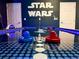 Fun game room with Star Wars themed decor and an air hockey table for entertainment at 6004 Oak Green Loop, Davenport, FL 33837