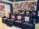 Enjoy movies in this home theater with leather recliners and fun movie poster art at 6004 Oak Green Loop, Davenport, FL 33837