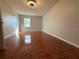 Bright bedroom featuring tile flooring, neutral walls, and natural light at 6725 Sawmill Blvd, Ocoee, FL 34761