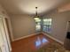 Bright dining area featuring tile floors, natural light from the window, and a modern light fixture at 6725 Sawmill Blvd, Ocoee, FL 34761