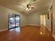 Spacious living room featuring tile flooring and sliding glass door at 6725 Sawmill Blvd, Ocoee, FL 34761