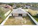 Aerial view showcases a fenced backyard with a patio in a neighborhood setting at 7214 Rex Hill Trl, Orlando, FL 32818