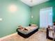 Another view of the spacious bedroom with a large window and bright walls at 7214 Rex Hill Trl, Orlando, FL 32818