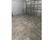 Empty garage featuring marble-style tiled floors at 7214 Rex Hill Trl, Orlando, FL 32818