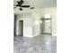 Bright living room featuring tiled floors and lots of natural light from the front door at 7214 Rex Hill Trl, Orlando, FL 32818