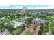 Aerial view of resort amenities including pool, clubhouse, and tennis courts at 7465 Gathering Loop, Reunion, FL 34747