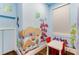 Basement area with mushroom wall paintings and a play area at 7465 Gathering Loop, Reunion, FL 34747