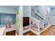 Whimsical basement staircase with charming mushroom and butterfly wall paintings at 7465 Gathering Loop, Reunion, FL 34747