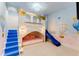 room with a castle theme that features gold trim, stairs to bed, slide, and hot air balloon theme at 7465 Gathering Loop, Reunion, FL 34747