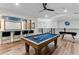 Game room featuring a pool table, foosball, and wet bar at 7465 Gathering Loop, Reunion, FL 34747