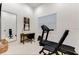 Bright home gym with treadmill, weight rack, and mirror at 7465 Gathering Loop, Reunion, FL 34747