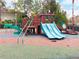 A vibrant playground featuring slides, climbing structures, and a cushioned play area at 7465 Gathering Loop, Reunion, FL 34747