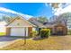 Charming single-Gathering home featuring brick and siding accents, attached garage, and landscaped front yard at 762 Lake Como Dr, Lake Mary, FL 32746