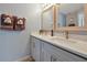 Bathroom featuring double sinks with modern fixtures and ample counter space providing convenience and style at 7671 Otterspool St, Kissimmee, FL 34747