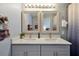 Bathroom featuring double sinks with modern fixtures and ample counter space providing convenience and style at 7671 Otterspool St, Kissimmee, FL 34747