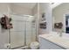 Bright bathroom featuring a glass-enclosed shower, modern fixtures, and neutral color palette for a clean, updated look at 7671 Otterspool St, Kissimmee, FL 34747