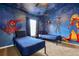 Whimsical bedroom featuring custom murals and twin beds, creating a fun and imaginative space for children at 7671 Otterspool St, Kissimmee, FL 34747