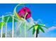 A close-up of a splash pad with a colorful flower water feature with sprays for to enjoy at 7671 Otterspool St, Kissimmee, FL 34747