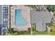 Aerial view of community pool, clubhouse and parking, showcasing amenities and property layout at 7709 Sundial Ln, Orlando, FL 32819