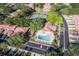 Aerial view of a community featuring a pool, tennis court, and landscaping at 7709 Sundial Ln, Orlando, FL 32819