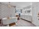 This bathroom has a freestanding tub, double vanity, modern lighting, and stylish wallpaper at 7709 Sundial Ln, Orlando, FL 32819