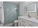 Bathroom featuring a modern shower with sliding glass doors and a white vanity at 7709 Sundial Ln, Orlando, FL 32819