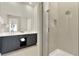 Modern bathroom with a double vanity, large mirror, and tiled walk-in shower at 7770 Sandy Ridge Dr # 212 Bldg 27, Kissimmee, FL 34747