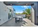 A covered rooftop deck with an outdoor dining table provides a great space for relaxation at 7770 Sandy Ridge Dr # 212 Bldg 27, Kissimmee, FL 34747