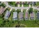 Aerial view of a house showcases its pool and backyard in a neighborhood with mature trees at 7916 Golden Pond Cir, Kissimmee, FL 34747