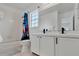 Bright bathroom with double sink vanity, tub and Spiderman shower curtain at 7916 Golden Pond Cir, Kissimmee, FL 34747